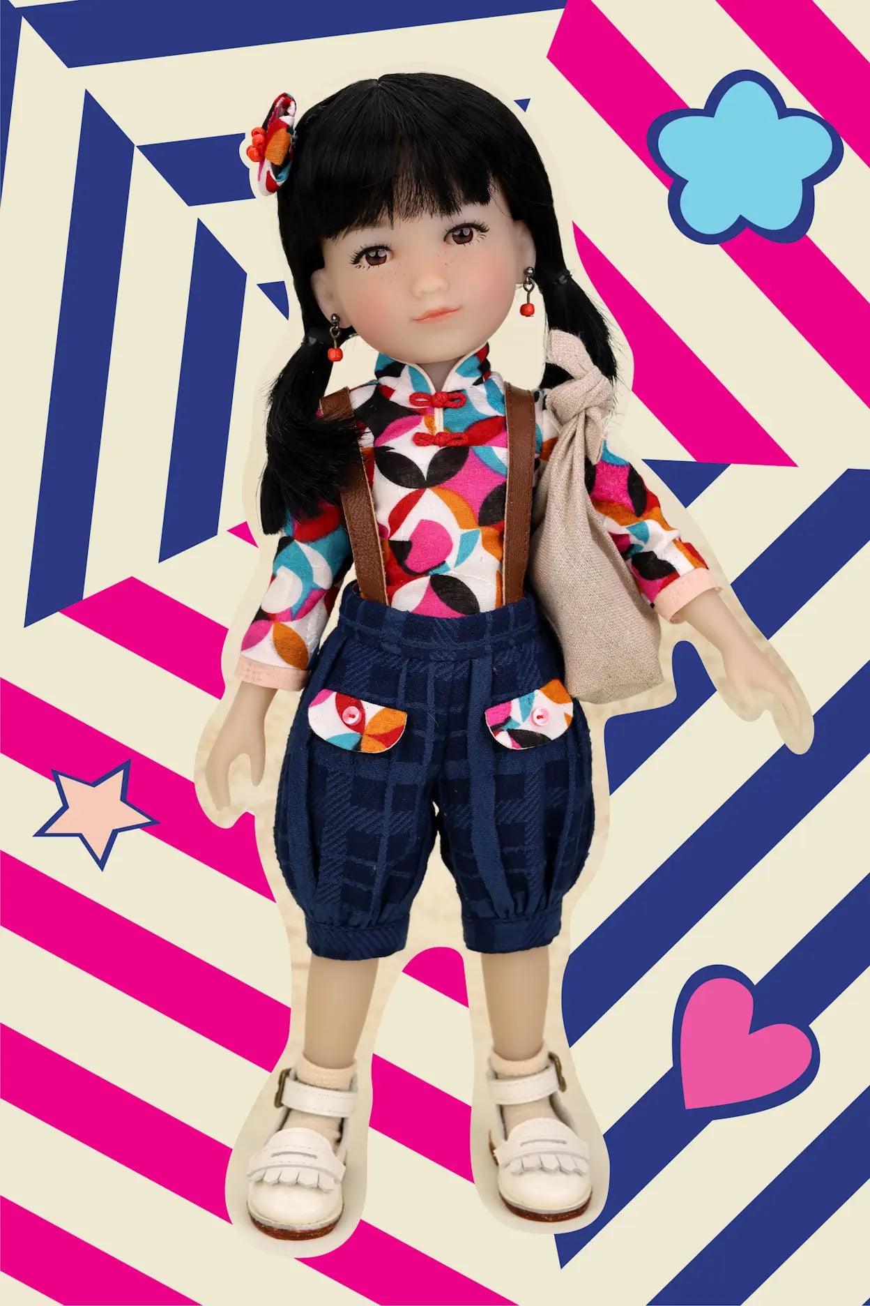 Doll with colorful outfit on a patterned background