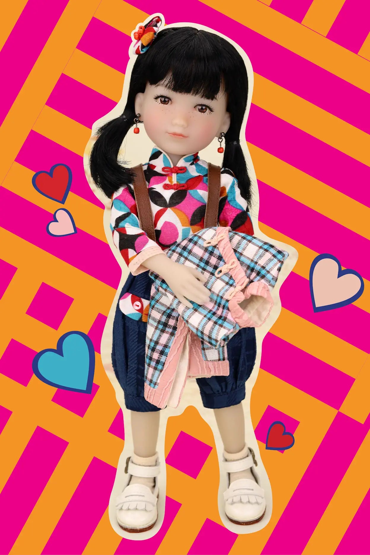 Doll with colorful outfit on a vibrant pink and orange striped background