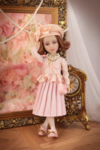 Lou in a pink dress with a decorative background