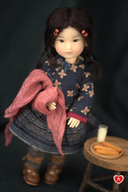 Doll holding a pink scarf  with a dark background
