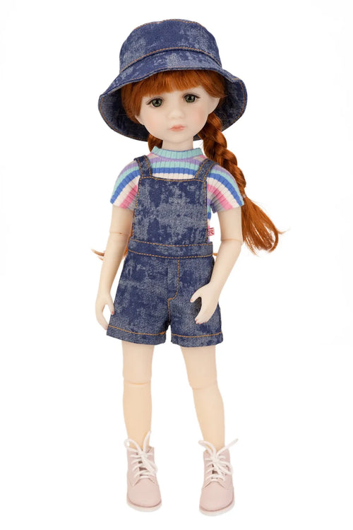 Doll wearing a denim outfit with a hat on a white background