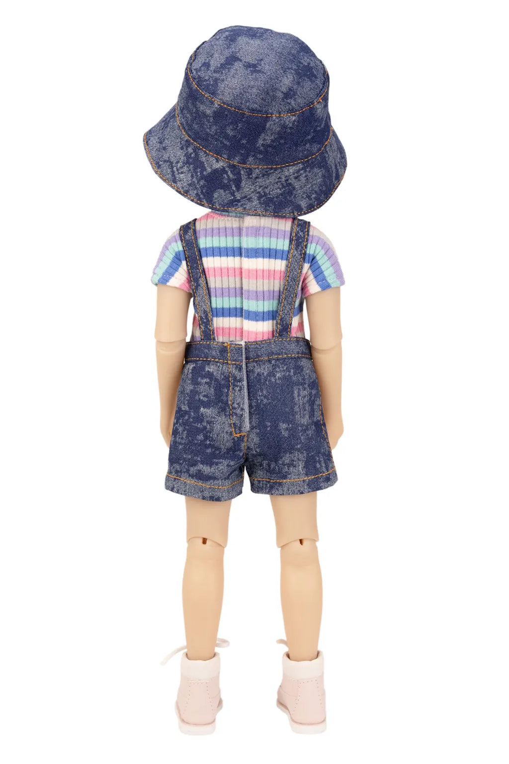 Doll wearing a denim outfit with a striped shirt on a white background
