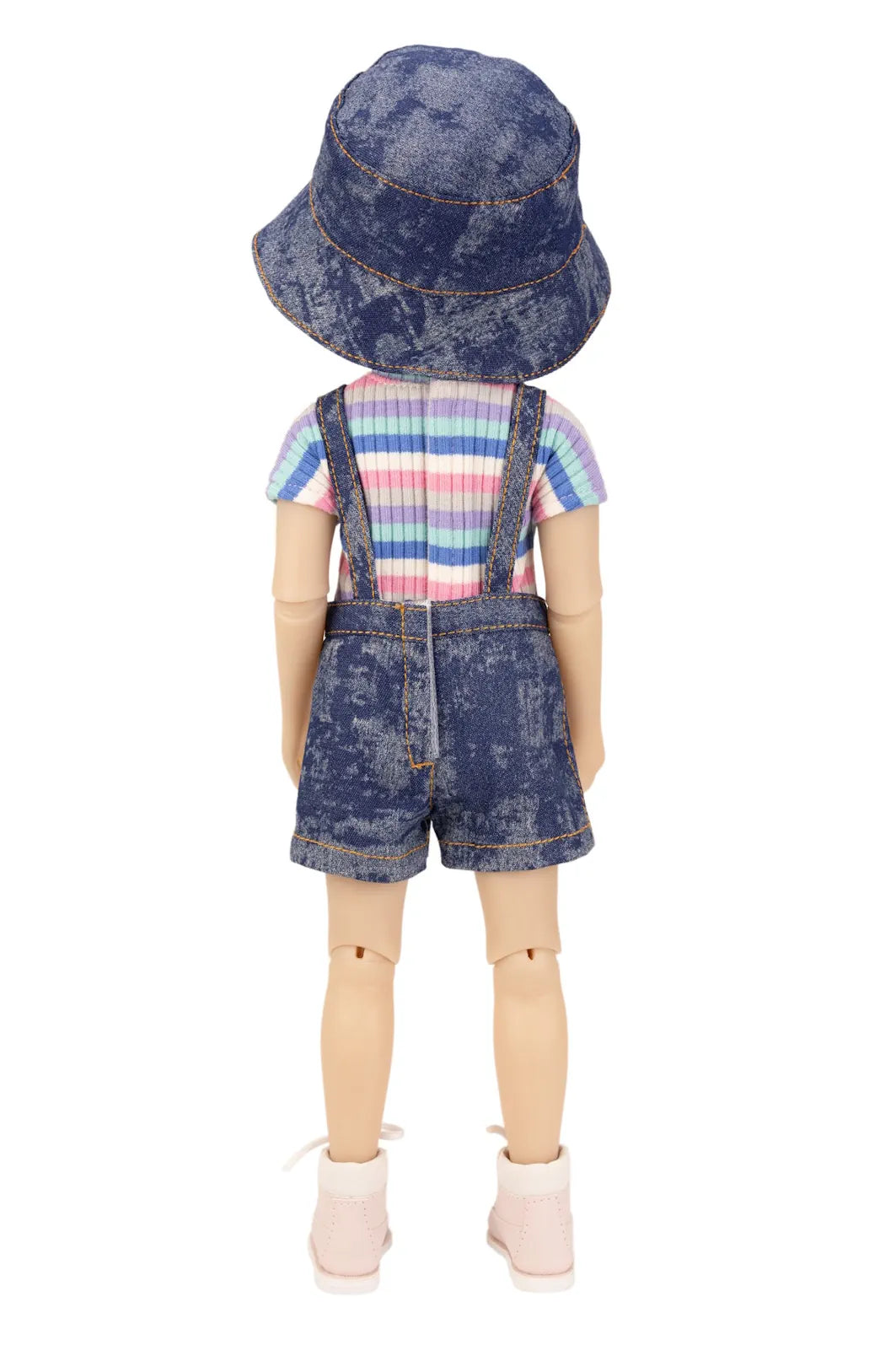 Doll wearing a denim outfit with a striped shirt on a white background