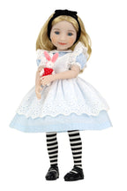 Doll in Alice in Wonderland outfit holding a rabbit plush toy on a white background