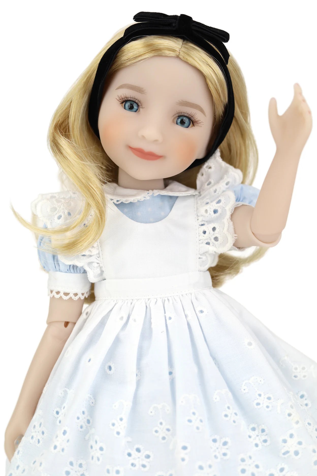 Doll with blonde hair and a white dress with blue accents