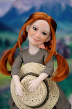 Doll with red hair holding a woven basket against a blurred natural background