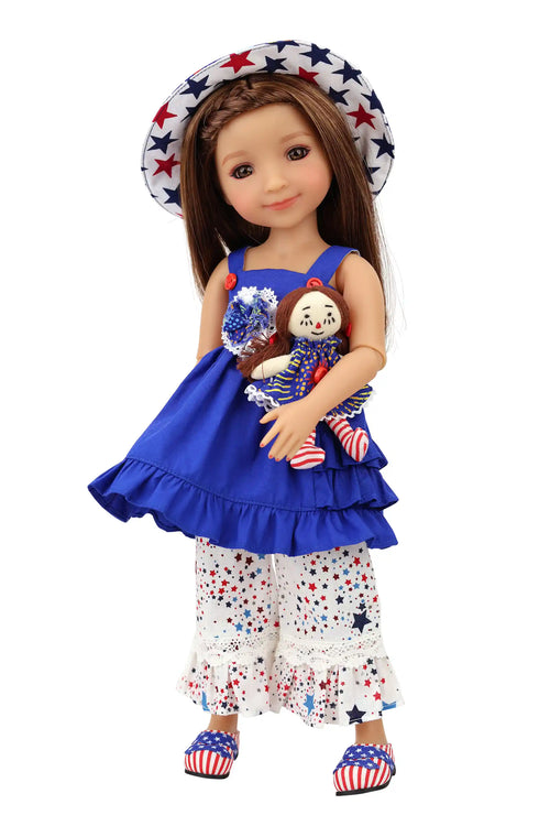 Doll wearing a blue dress with ruffles, white pants with blue stars, and a matching hat on a white background.