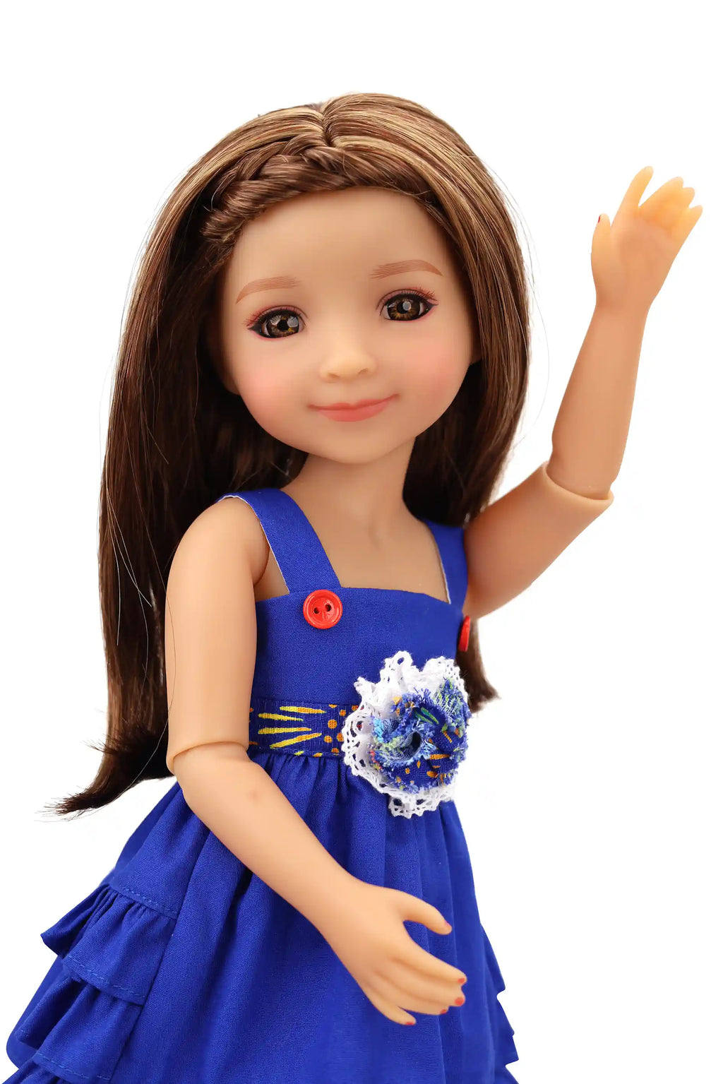 Doll wearing a blue dress with a floral accessory on a white background