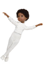 Doll wearing a white outfit on a white background