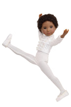 Doll in a white outfit with one leg raised on a white background
