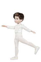 Doll in a white ballet outfit on a white background