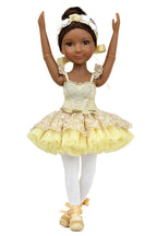 Doll in a yellow ballet outfit with white accents on a white background
