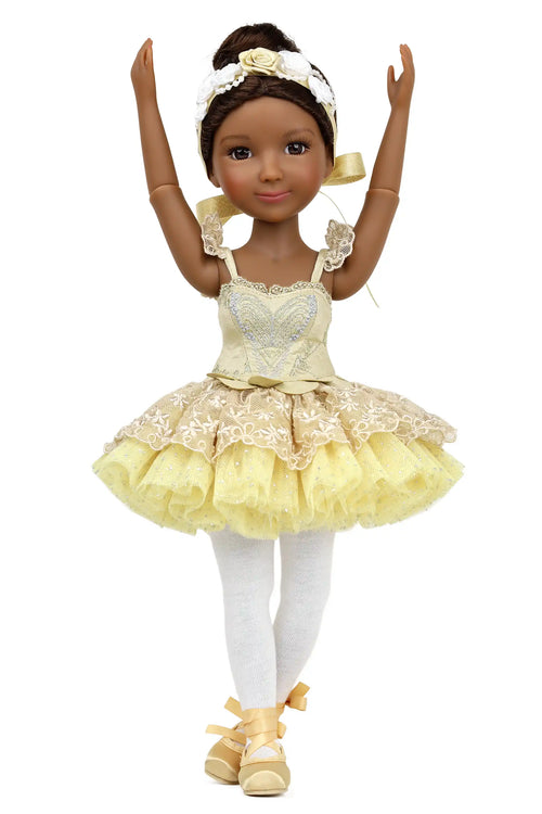 Doll in a yellow ballet outfit with white accents on a white background