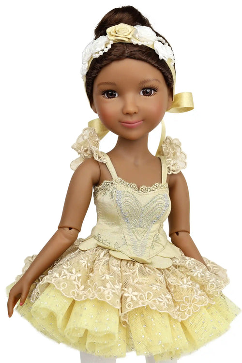Doll in a yellow ballet outfit with white accents on a white background