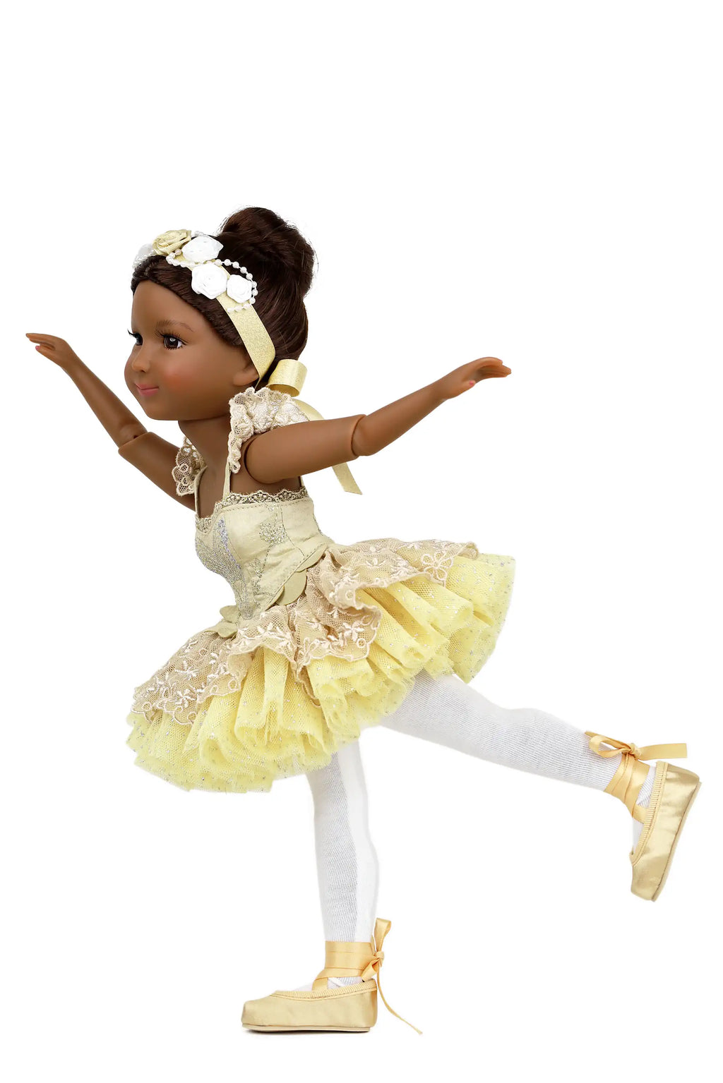 Doll in a yellow ballet outfit with white accents on a white background