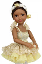 Doll in a yellow dress with lace details on a white background