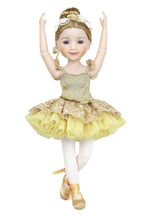 Ballet doll in a yellow and gold dress on a white background