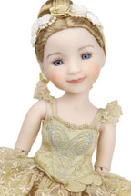 Doll in a detailed yellow dress with floral headpiece on a white background