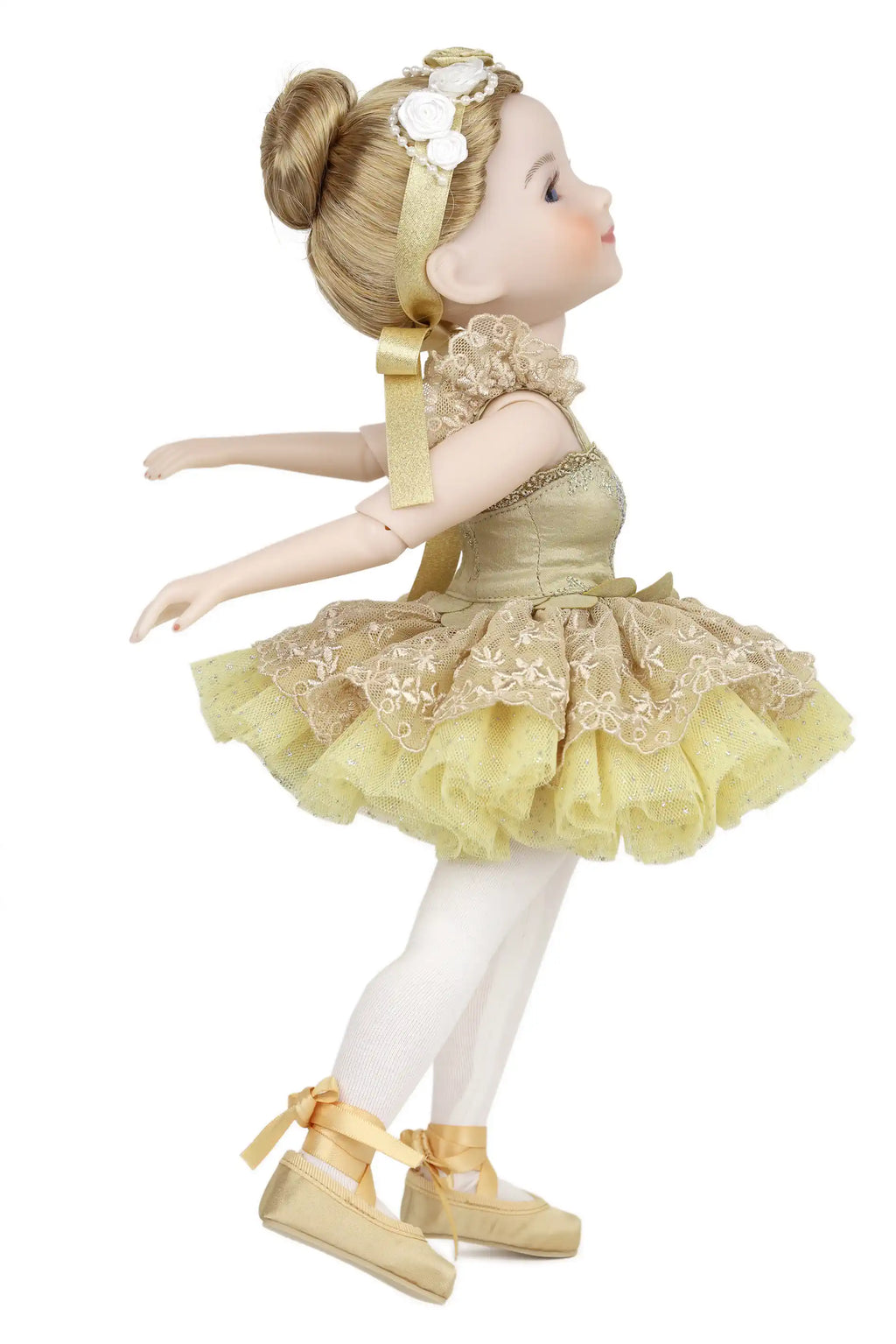 Doll in a yellow dress with floral details on a white background