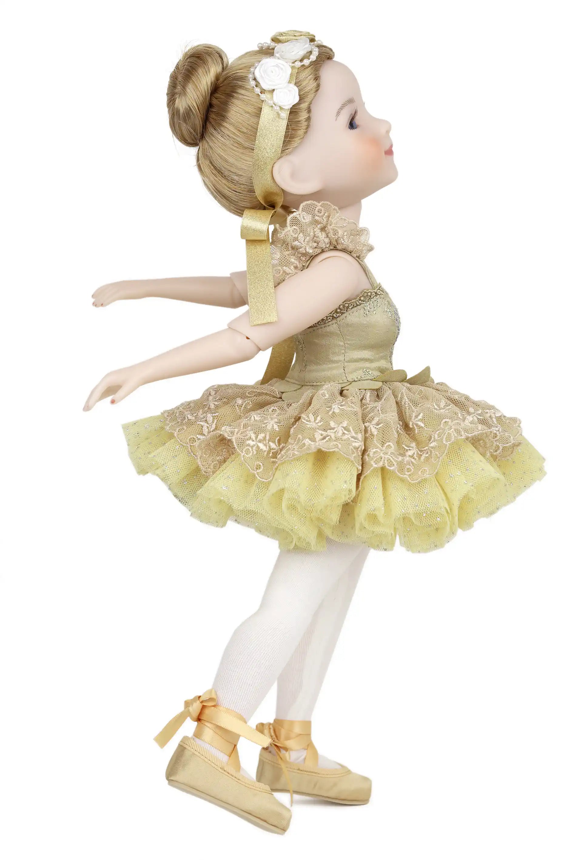 Doll in a yellow dress with floral details on a white background
