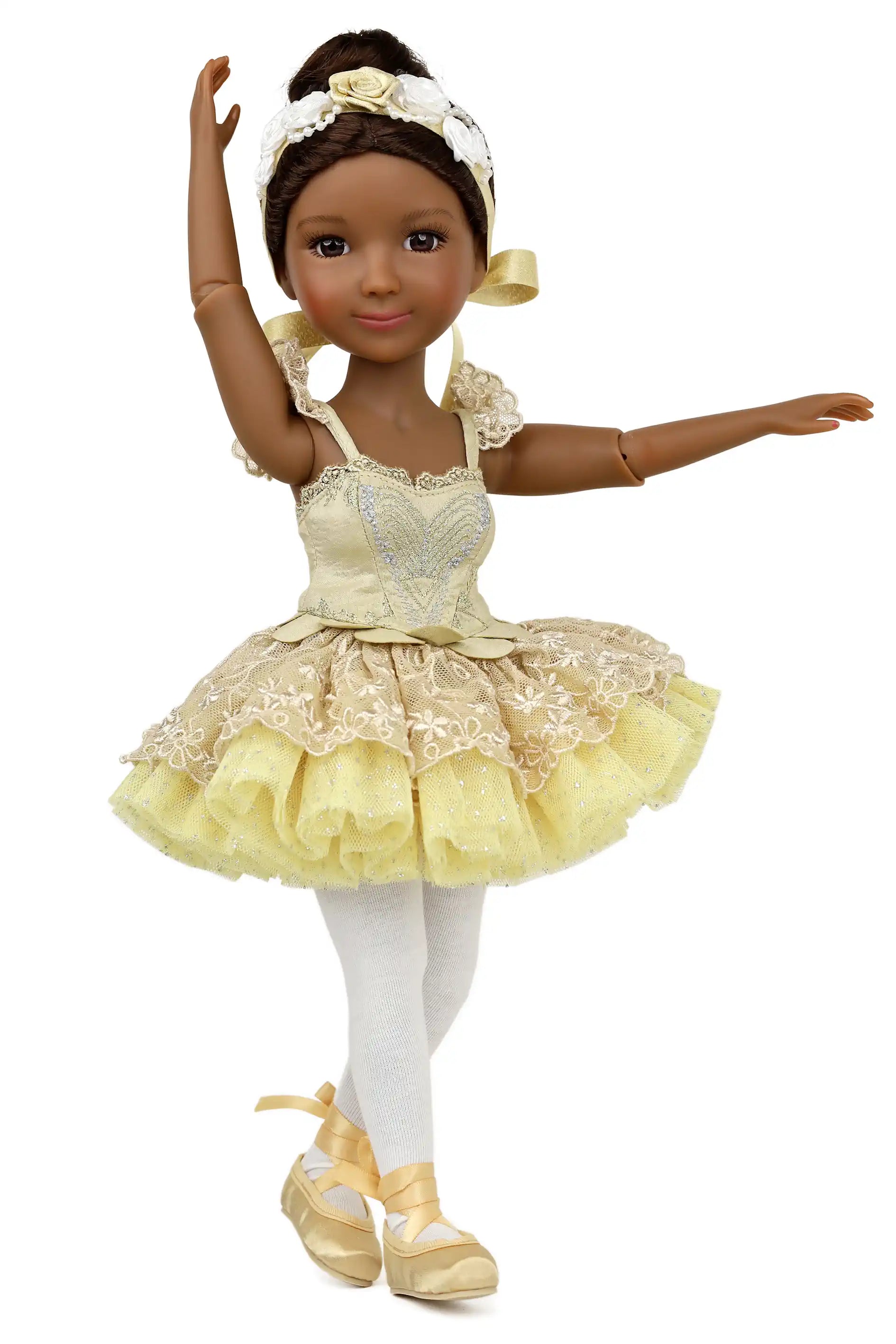 Doll in a yellow ballet outfit with white accents on a white background