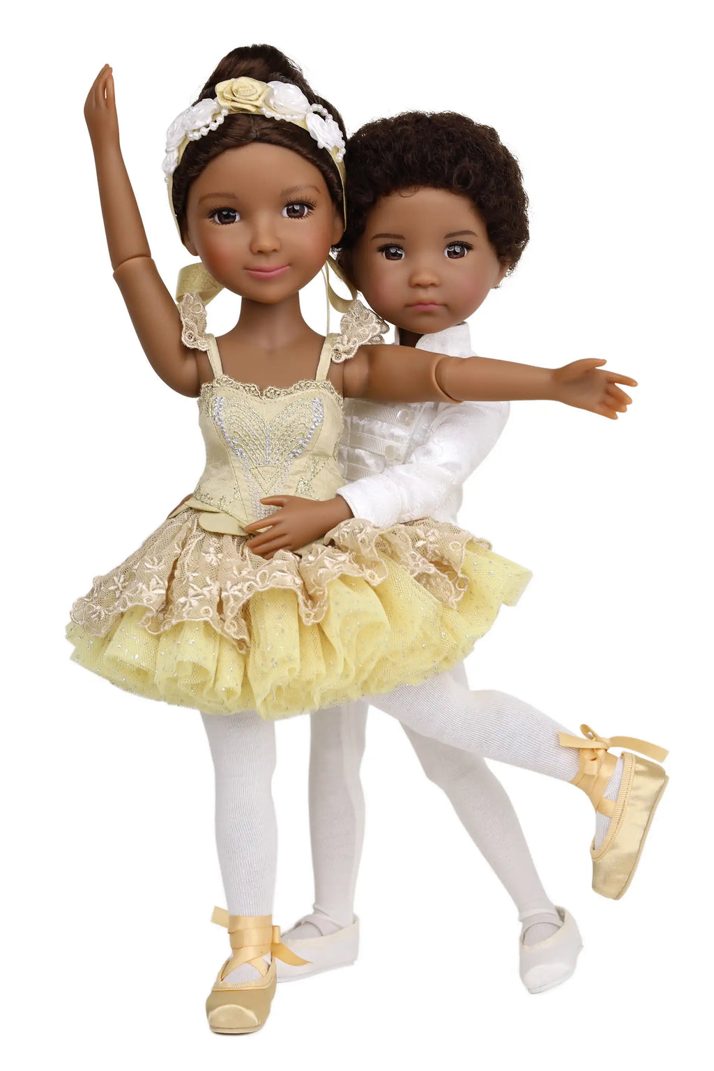 Two dolls in ballet attire on a white background
