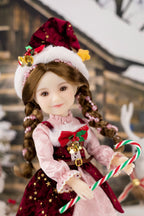 Christmas-themed doll with a red hat and candy canes, standing against a blurred decorative background.