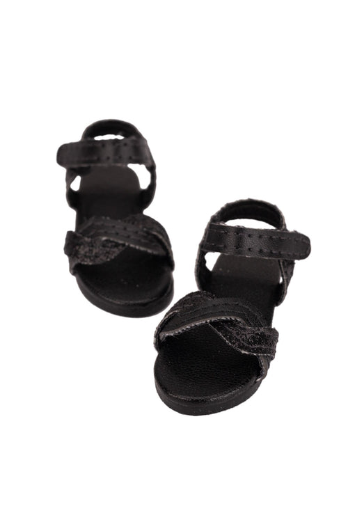 Pair of black sandals on a white background