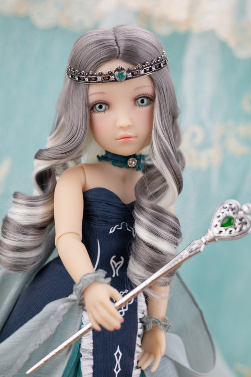 Doll with gray hair and a blue dress holding a staff against a light blue background