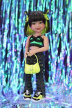 Doll with black and green outfit holding a yellow handbag against a colorful, abstract background