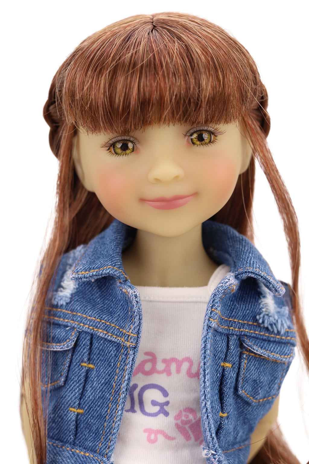 Bella wearing a denim jacket, colorful skirt, and pink shoes on a white background