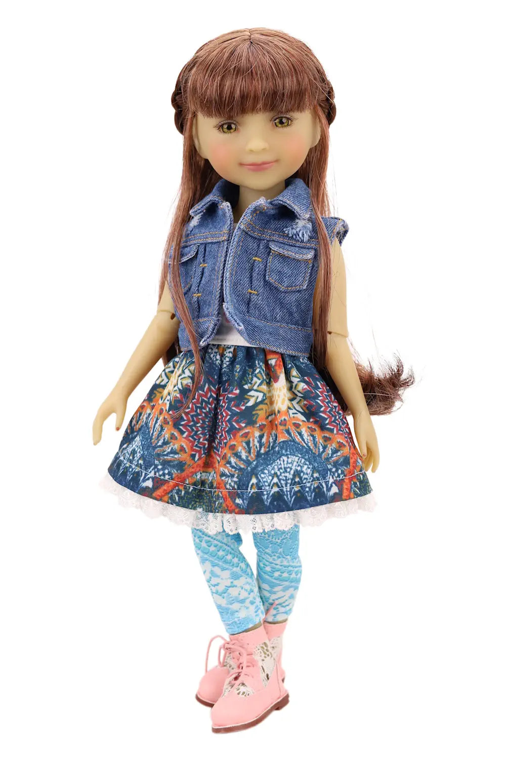 Doll wearing a denim jacket, floral dress, and pink shoes on a white background