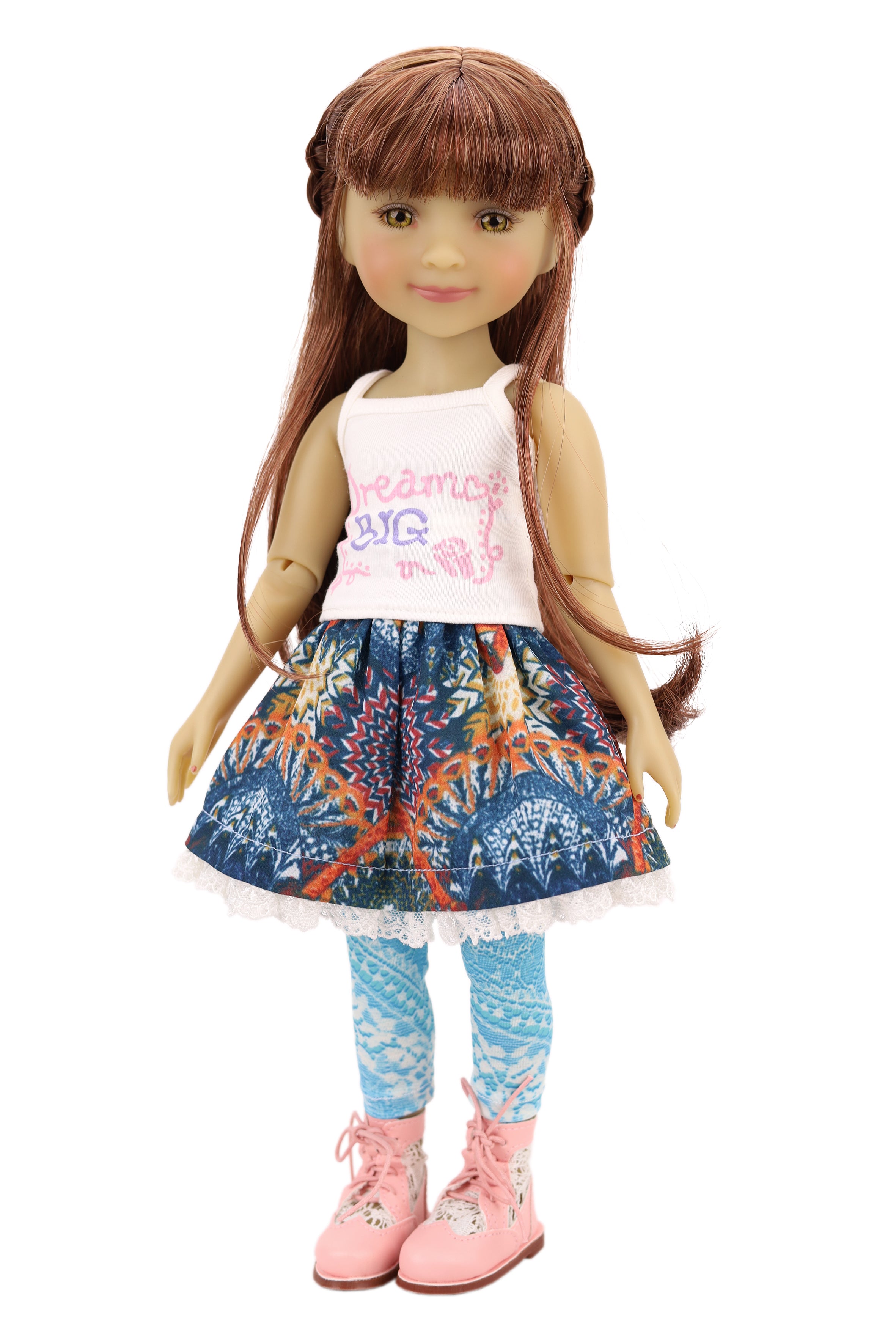 Bella wearing a denim jacket, colorful skirt, and pink shoes on a white background