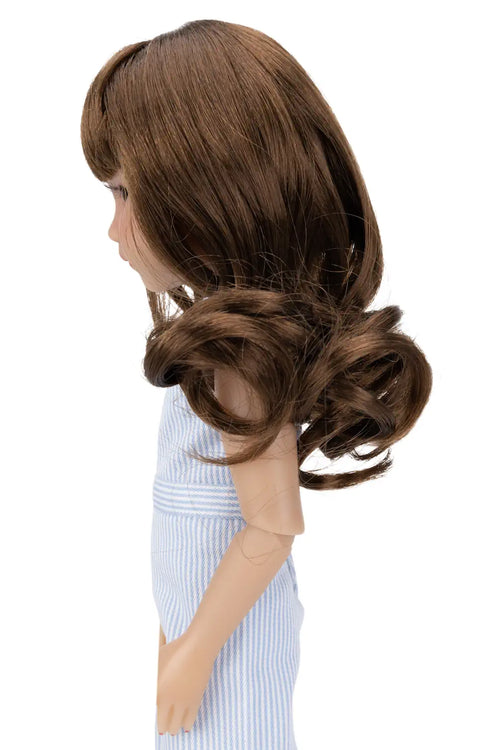Doll with long brown hair styled in an elegant updo on a white background