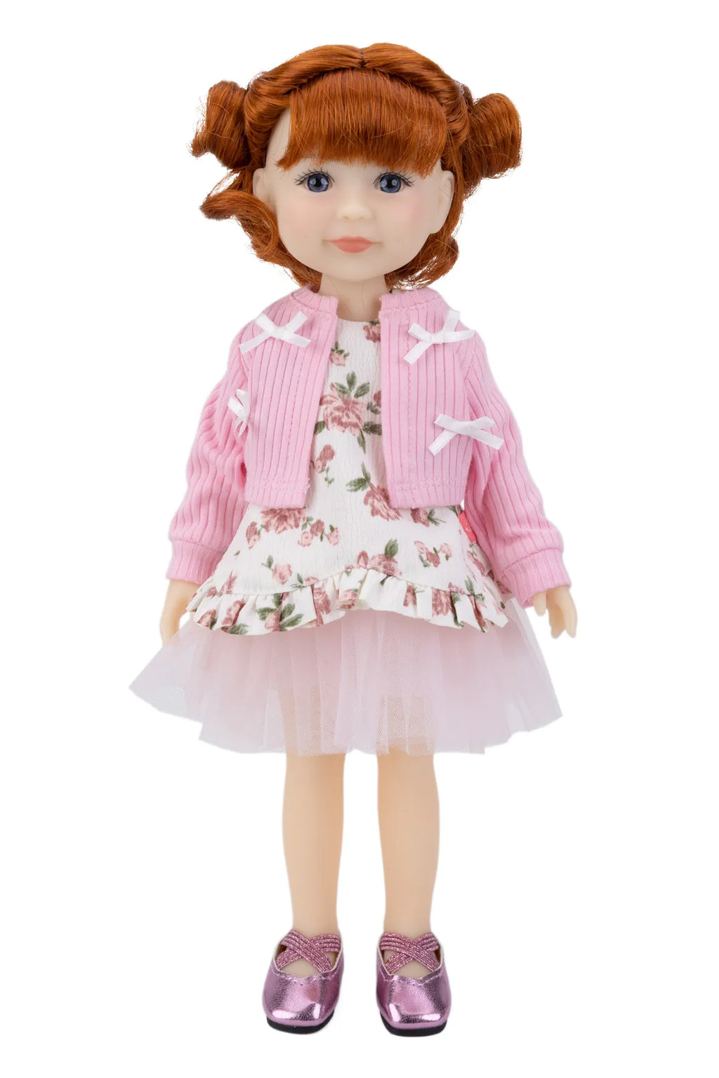 Doll with red hair wearing a pink jacket and floral dress on a white background