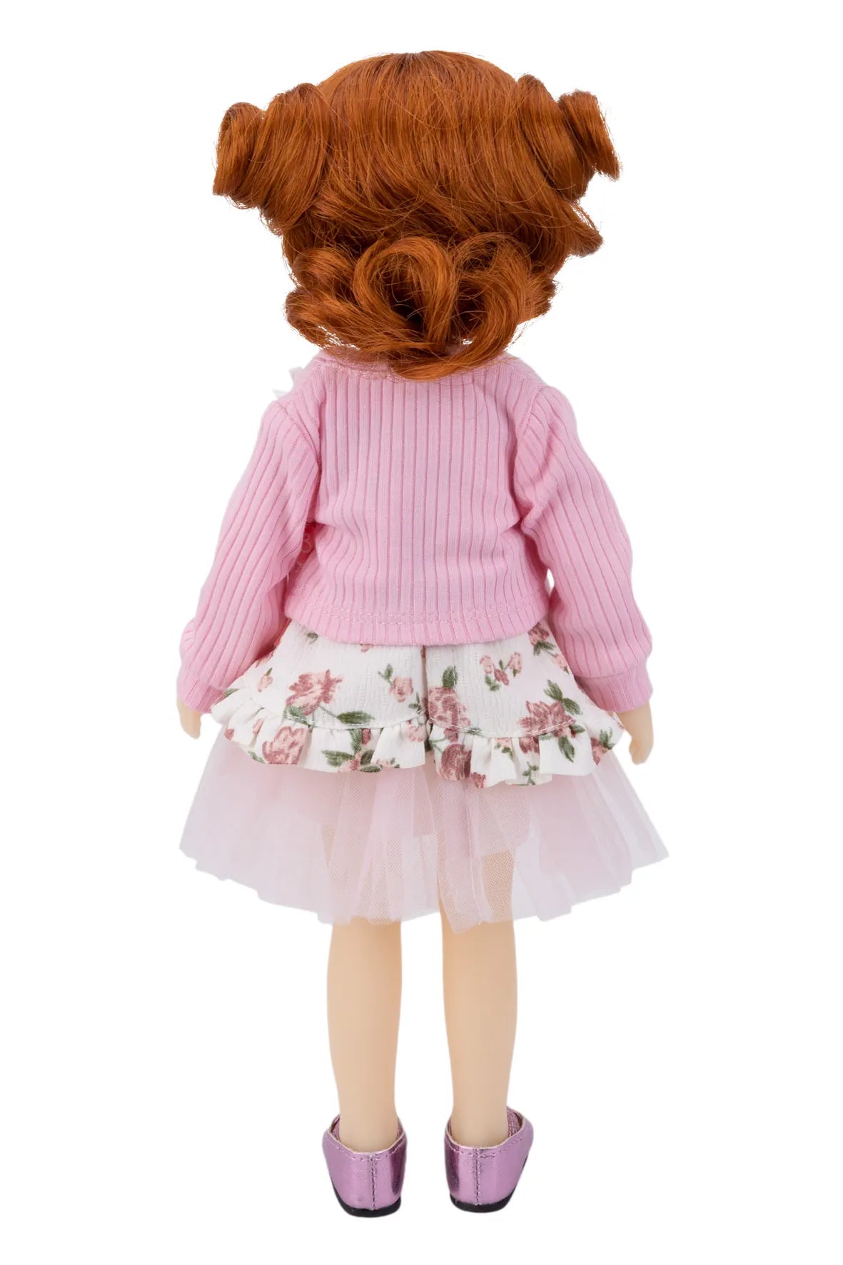 Doll with red hair styled in pigtails, wearing a pink sweater and floral skirt on a white background.