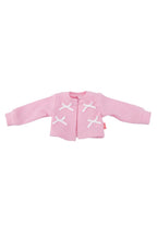 Pink doll cardigan with white cross patterns on a white background