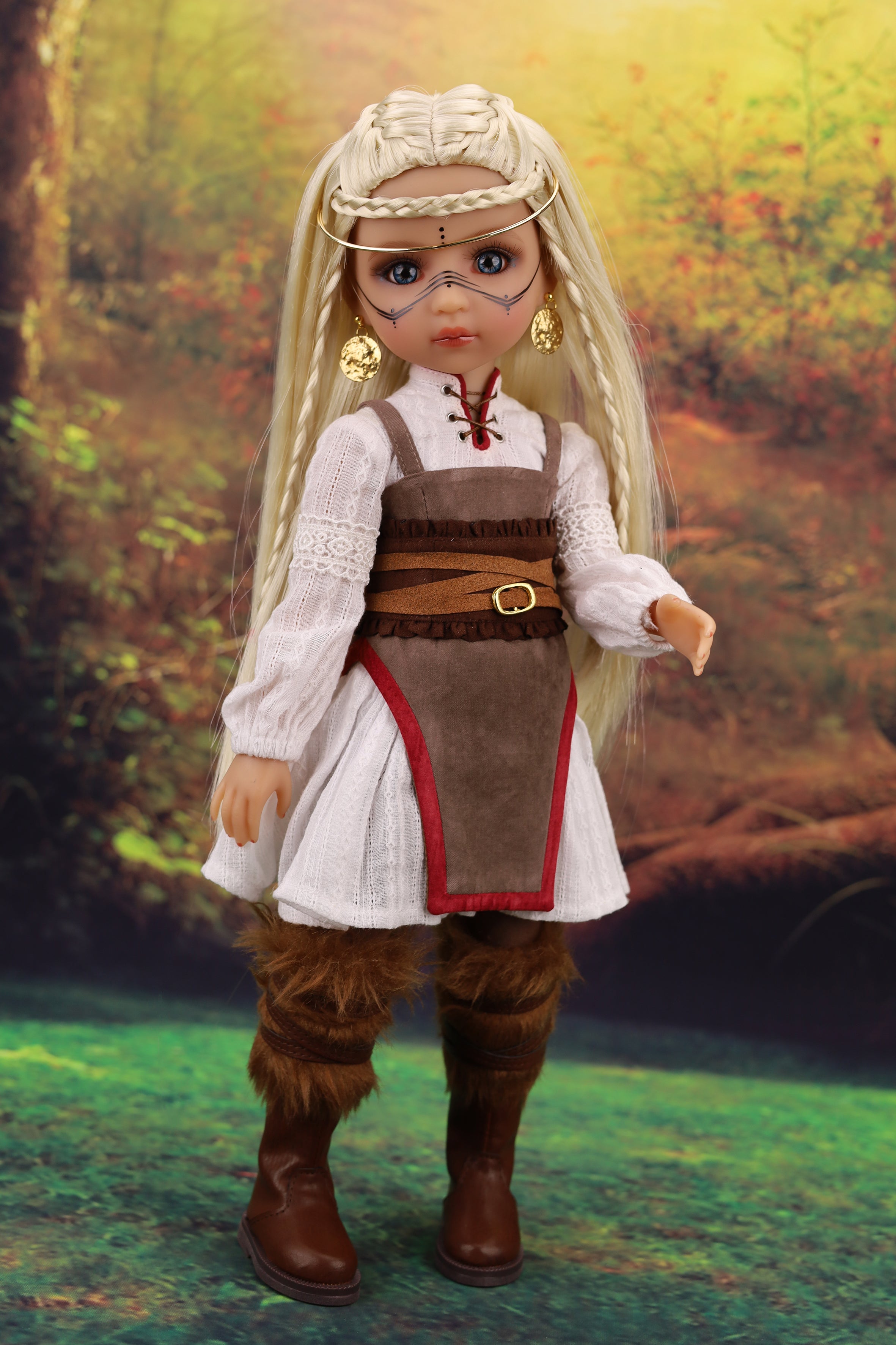 Doll in medieval outfit with a forest background