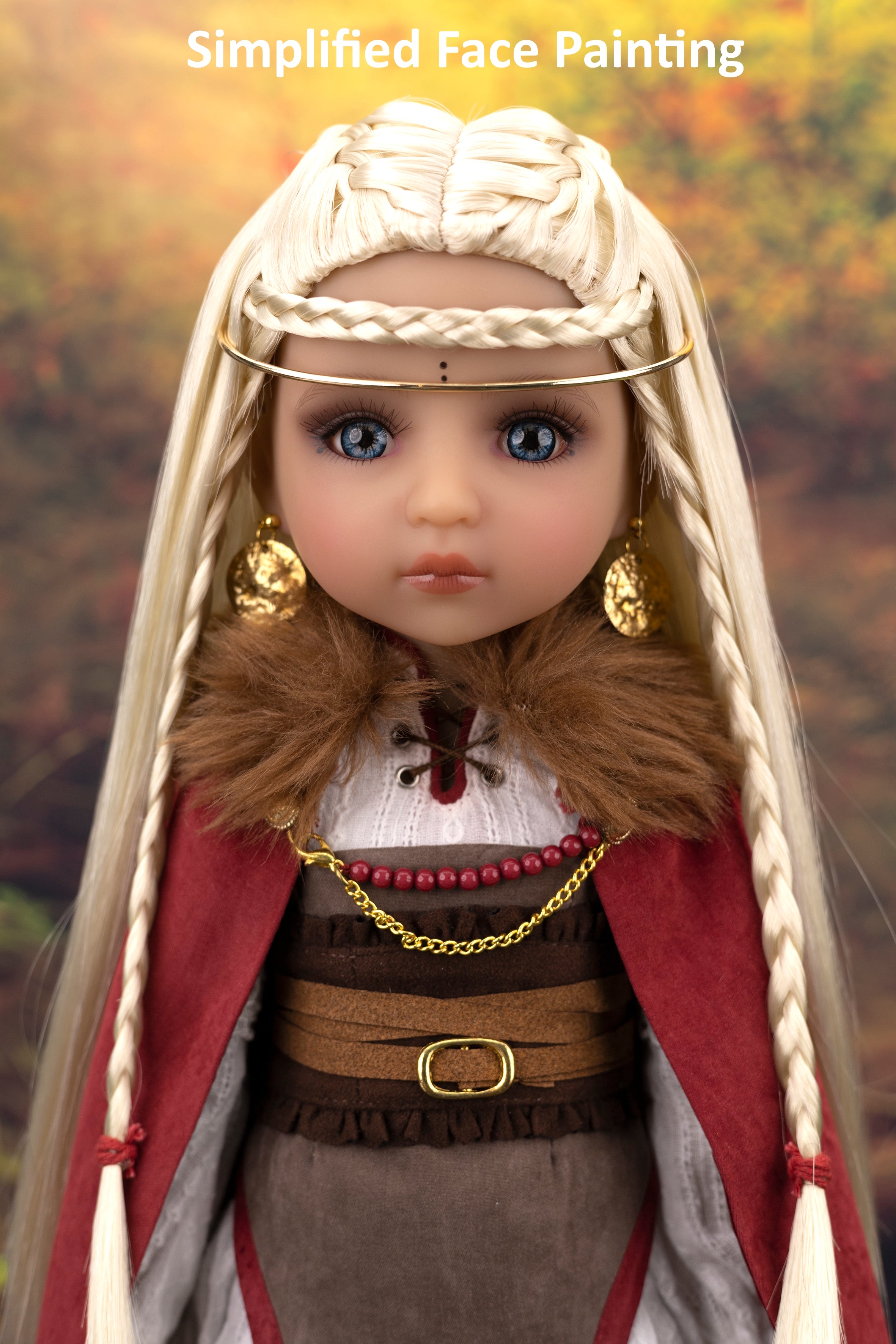 Doll with historical costume and headpiece against a blurred natural background