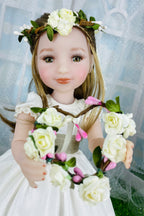 Doll with floral crown and bouquet against a light background