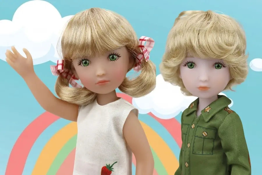 Two dolls with blonde hair against a colorful background