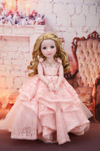 Doll in a pink dress standing in a decorative room with flowers and furniture. 