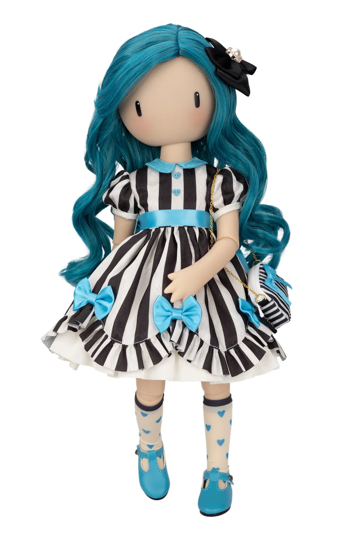 A Gorjuss doll with long bright blue hair, wearing a black-and-white striped dress with blue bows and trim, cream socks with blue hearts, and blue shoes, posed against a plain white background.
