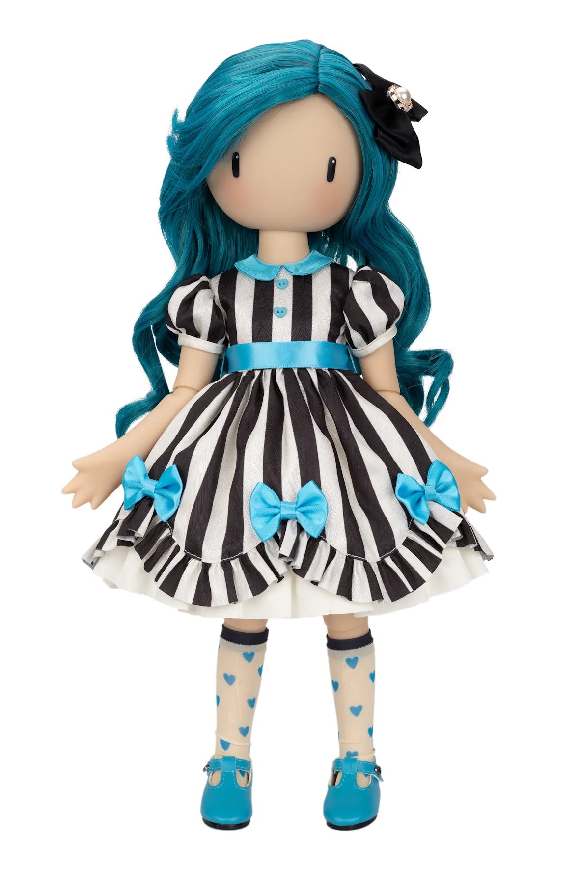 A Gorjuss doll with long teal-blue hair, wearing a black and white vertically striped dress with bright blue bows and trim, cream socks with blue hearts, and blue shoes, shown against a plain white background.