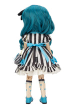 A Gorjuss doll viewed from the back wearing a black and white vertically striped dress with light blue accents, including a blue bow at the waist, blue shoes, and bright blue hair, on a plain white background.