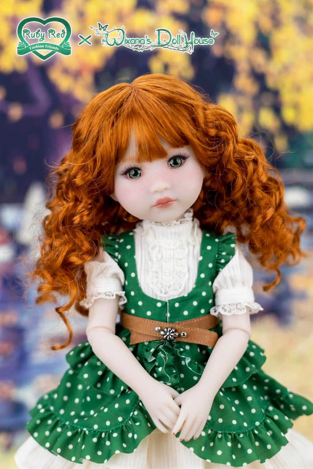Doll with red hair wearing a green dress with white polka dots against a blurred background