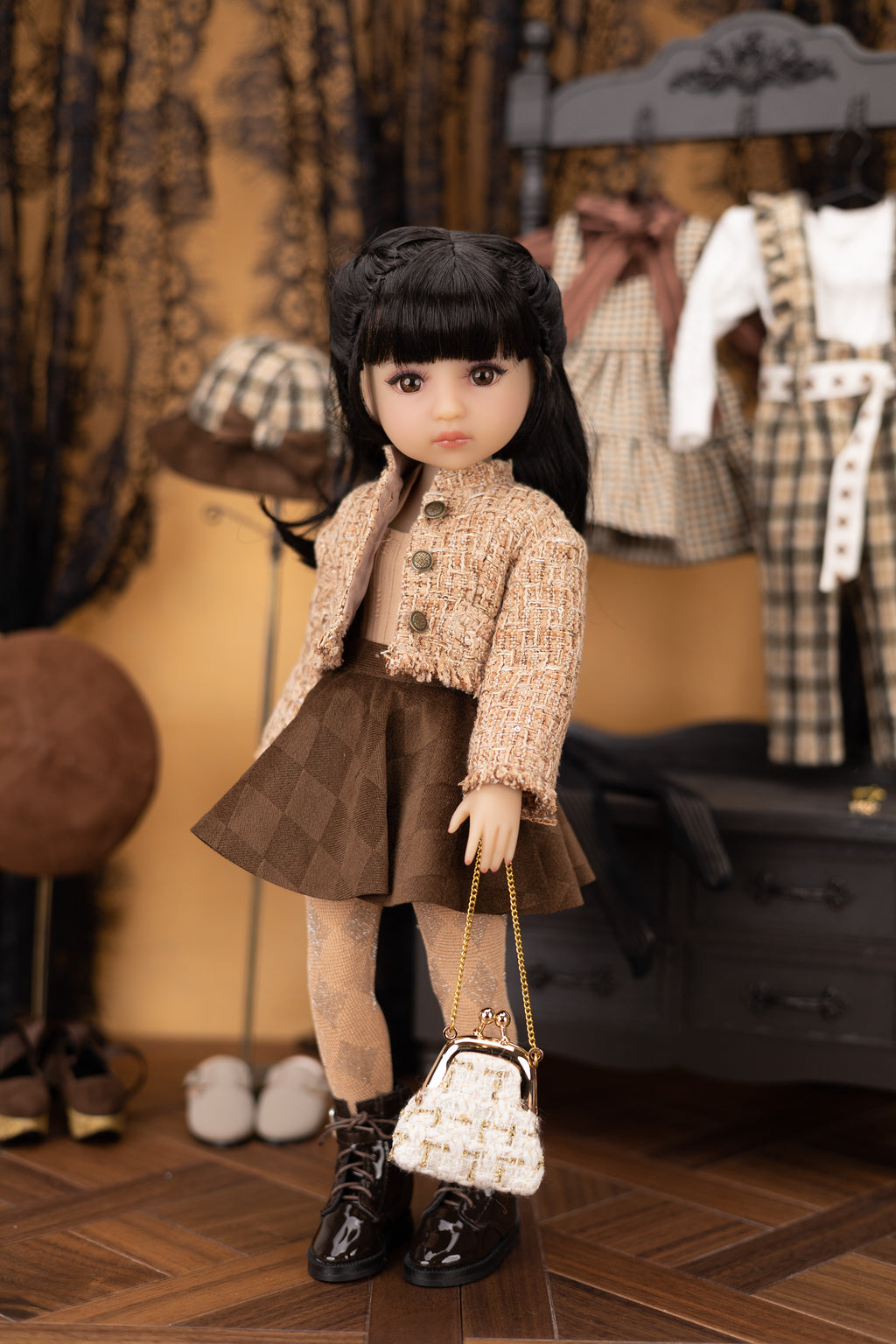 Doll in a stylish outfit with a handbag in a room with clothing and accessories.