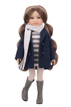 Doll wearing a navy coat, striped sweater, and gray boots on a white background