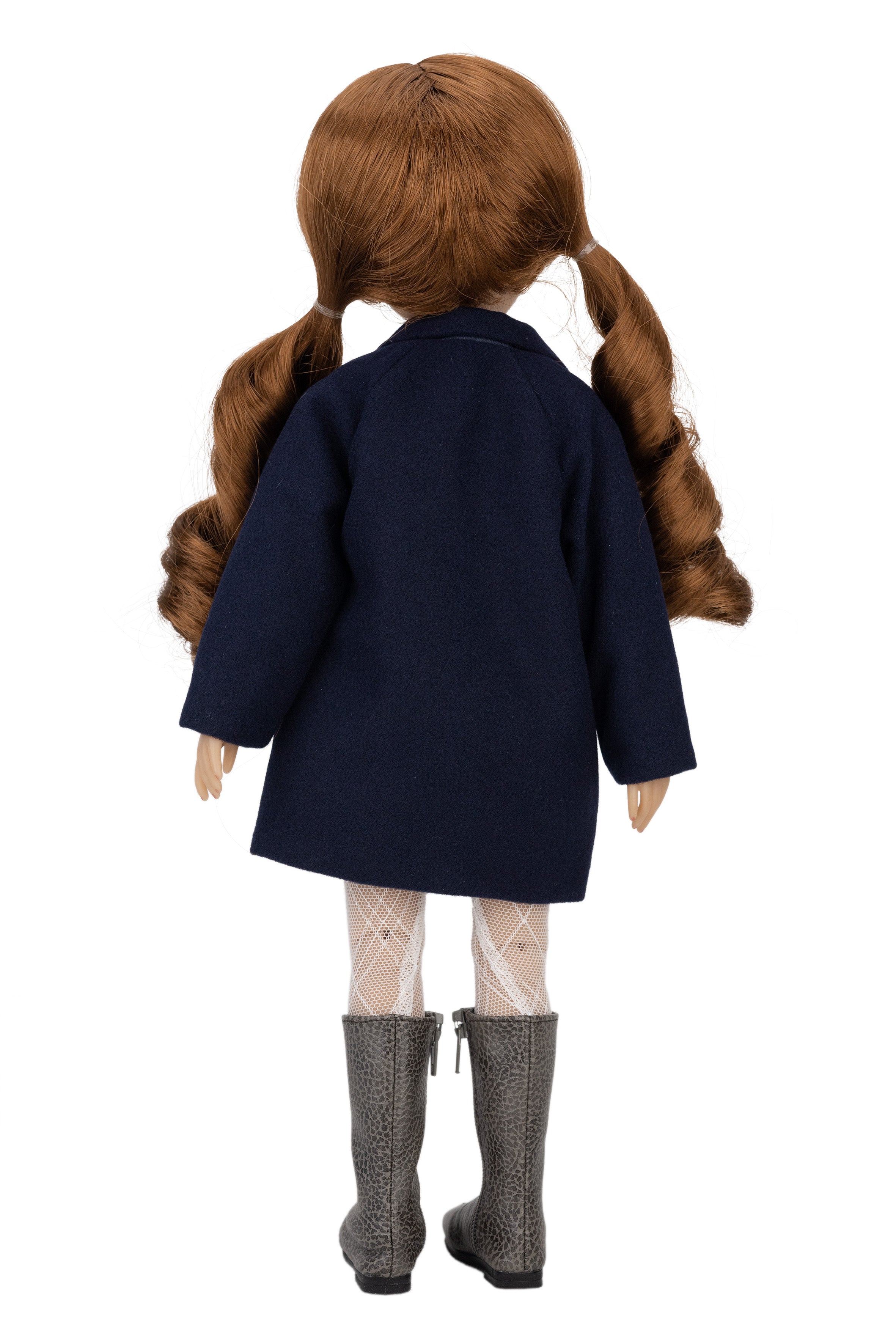Doll wearing a navy coat, white tights, and gray boots on a white background