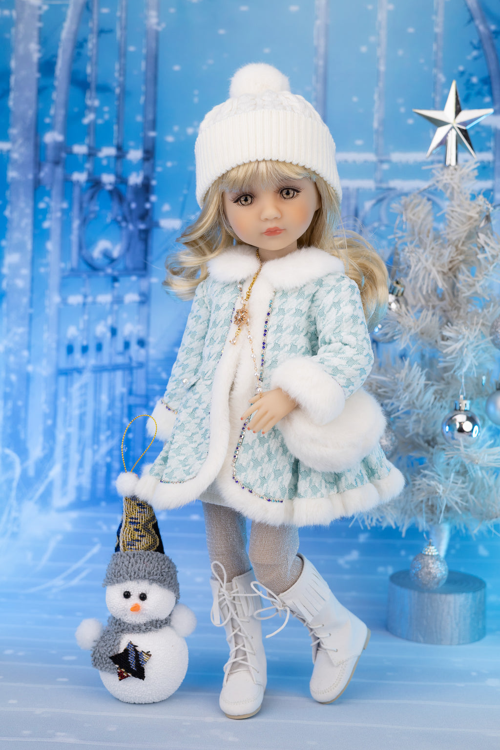 Doll in winter outfit with snowman and festive background
